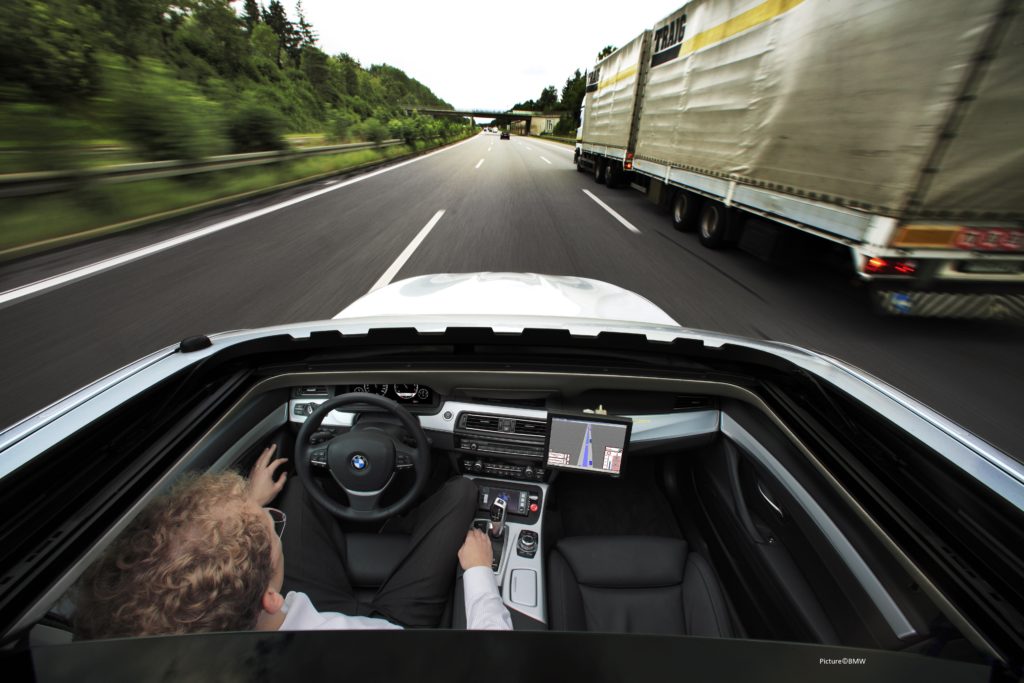 image shot through car sunroof of it overtaking a lorry on a motorway