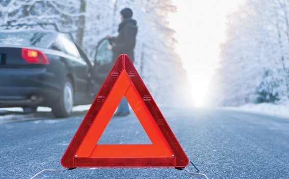image showing warning triangle by car stopped on frosty road