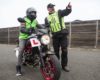 can you ride a 125cc on the motorway image showing motorbike rider with l plates being talked to by male instructor in hi viz vest